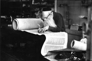 sofer restoring Torah scroll